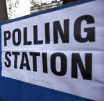 A Polling Station sign.