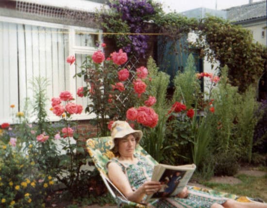 Christine relaxing and reading in the garden. 1977 to 1987 working in Aladdin’s cave.