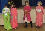 Four children in Babylonian costumes.