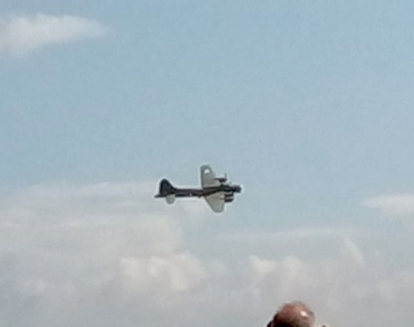 A bomber flying at Duxford. Skating on Little Fen, Earith and a plane crash. Earith WW2 and evacuees.
