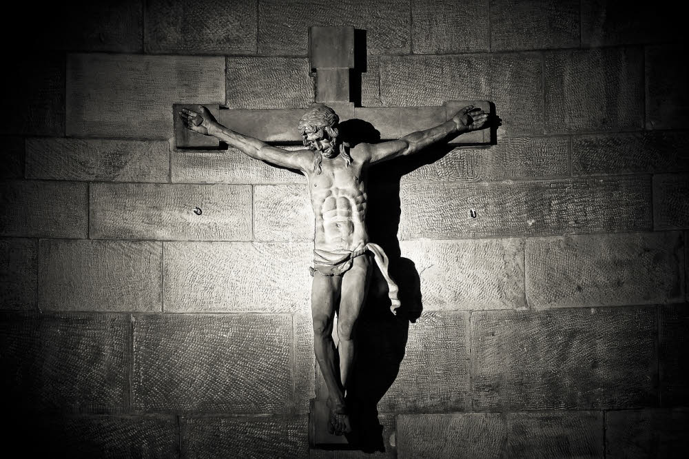 A statue of Jesus on the cross. Christian festival of Easter lesson plan.