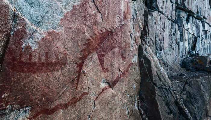 Rock painting of a dinosaur or dragon in Agawa Northern Ontario.