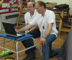 Adrian and Peter sorting out a laptop problem.