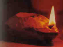 An old oil lamp burning.