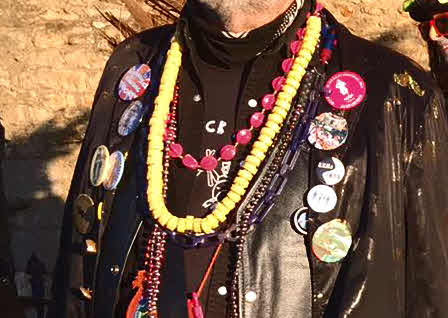Leather jacket studded with badges.