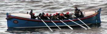 An open rowing lifeboat.