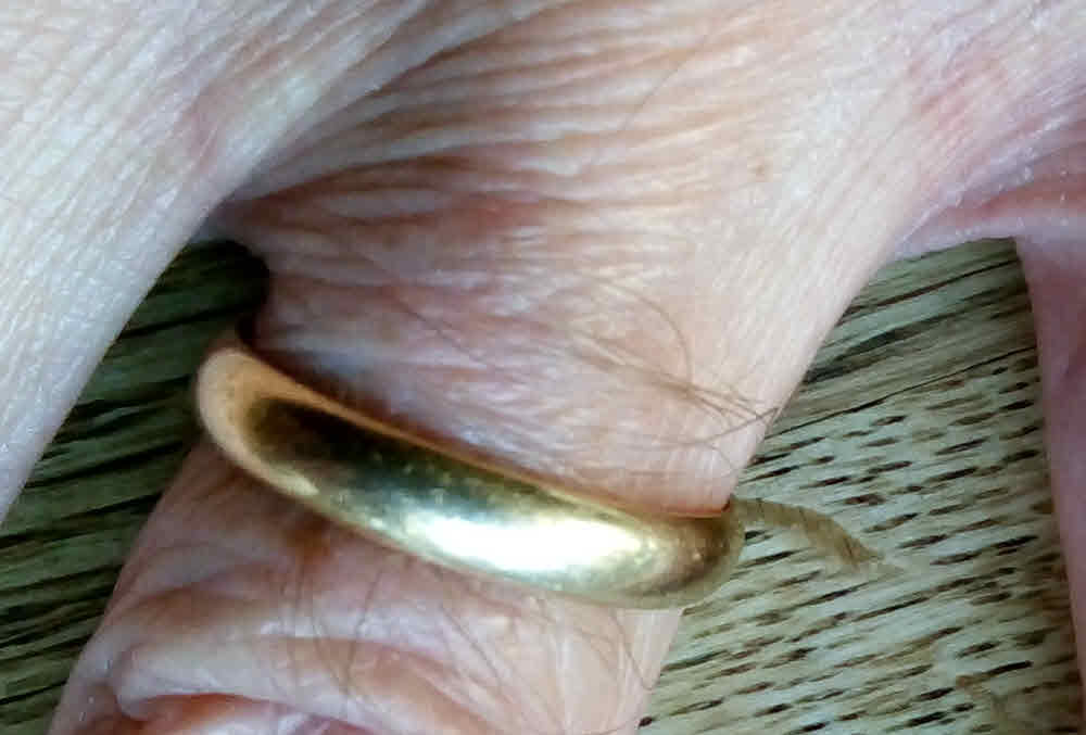 A man's wedding ring on his hand. Can Christians divorce and remarry?